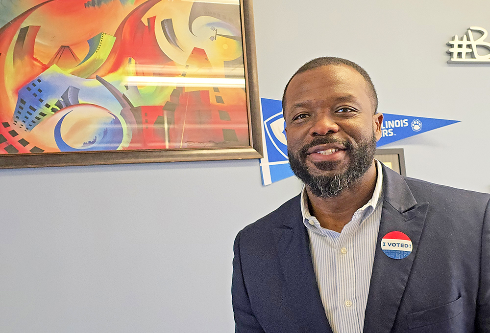 Homewood-Flossmoor High School Principal Clinton Alexander sports an "I voted" sticker Thursday, Feb. 25. He was the first voter at the school's polling place that morning. (Eric Crump/H-F Chronicle)
