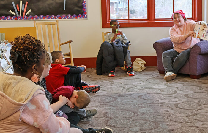 Librarian Carly Halberg reads to children during a story time as part of the library’s Lunar New Year celebration. (Nuha Abdessalam/H-F Chronicle)
