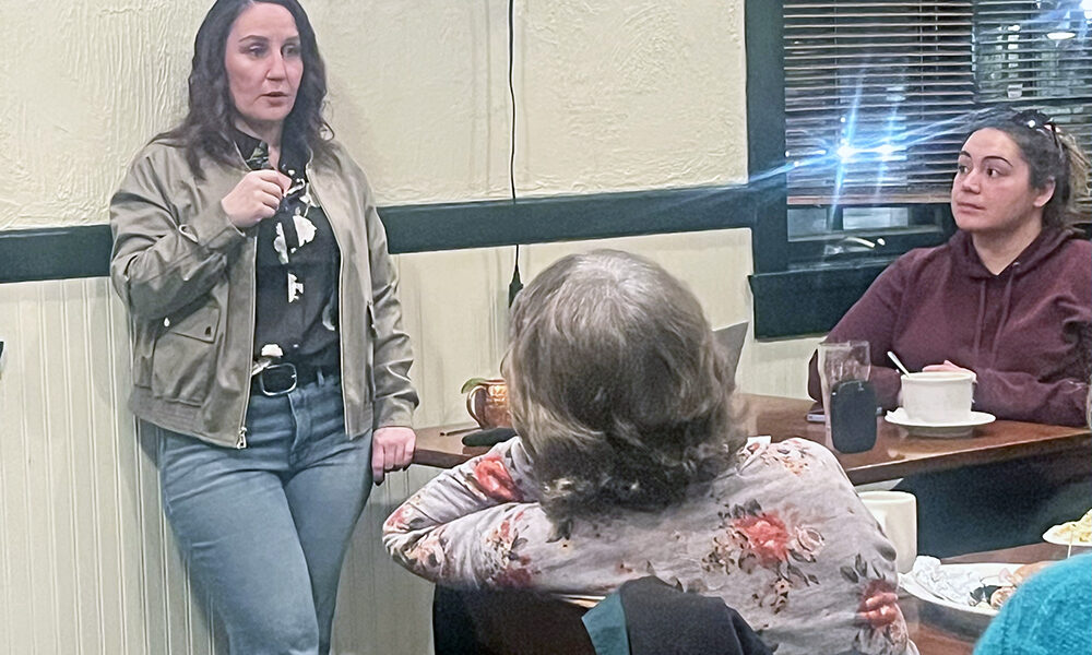Activist Liz Varmecky speaks at the Chicago Southland Green Drinks event Monday, Feb. 16, at Flossmoor Station Restaurant and Brewery. South Suburbs for Green Space member Rachel Smith looks on. (Nick Ulanowski / H-F Chronicle)