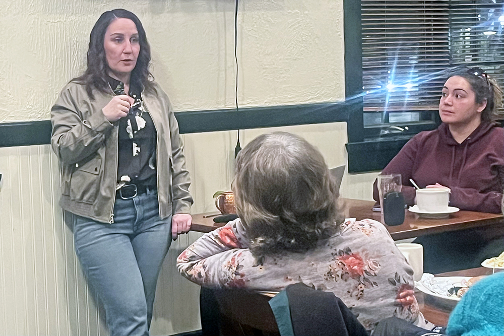 Activist Liz Varmecky speaks at the Chicago Southland Green Drinks event Monday, Feb. 16, at Flossmoor Station Restaurant and Brewery. South Suburbs for Green Space member Rachel Smith looks on. (Nick Ulanowski / H-F Chronicle)
