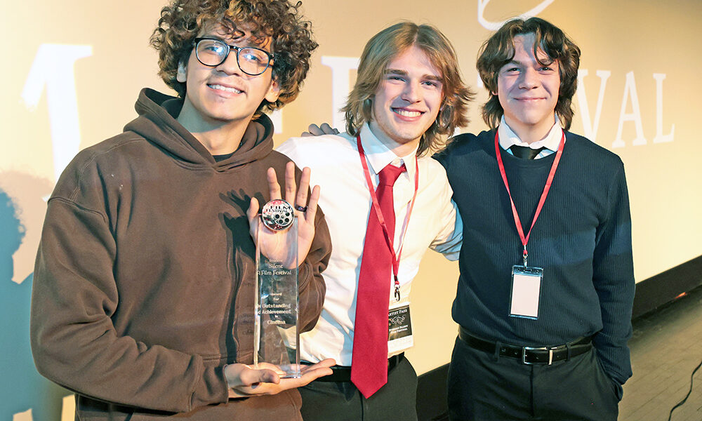 Homewood-Flossmoor High School students, from left, Anthony Reynoso, Joseph Klauk and Charles Wachtel were named winners of the 2026 Student Silent Film Festival Jan. 28 for their film “The Silence Between Us.” (Provided photo/James C. Svehla)