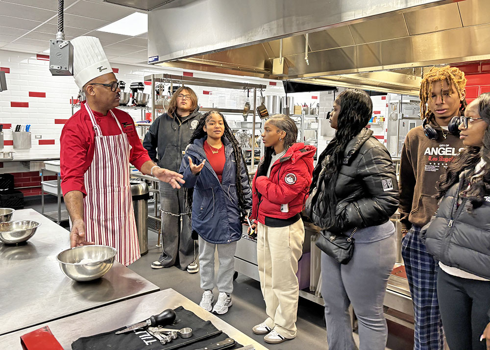 Chef Jerl Griffin speaks with students in a culinary class at Homewood-Flossmoor High School on March 20. (Marilyn Thomas/H-F Chronicle)