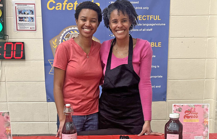 Zesty Zobo owner Michaiah Young, left, with her mother, LaTasha Young, at the Churchill School Black History Month event. (Nick Ulanowski H-F Chronicle)