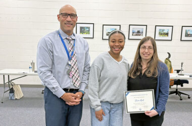 Teacher Elana Reid, right, received the #Above and Beyond honor from District 161. She was nominated by student Alani Jeffries, center. Joining them is Superintendent Dana Smith. (Marilyn Thomas/H-F Chronicle)