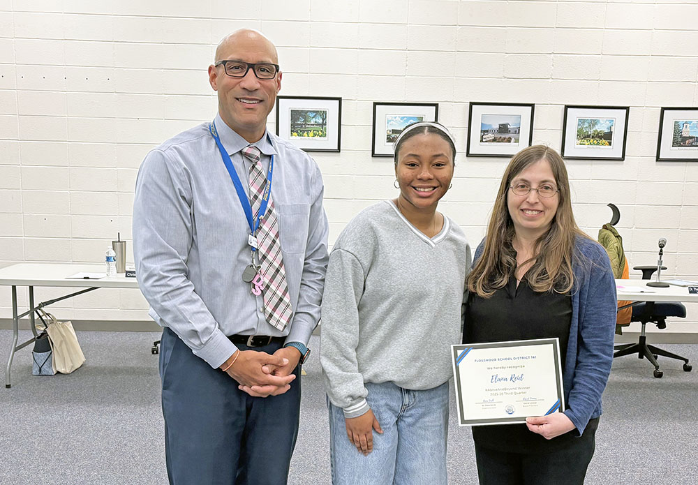 Teacher Elana Reid, right, received the #Above and Beyond honor from District 161. She was nominated by student Alani Jeffries, center. Joining them is Superintendent Dana Smith. (Marilyn Thomas/H-F Chronicle)