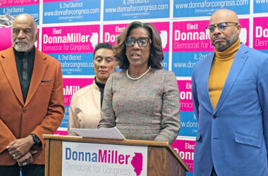 Donna Miller urges state and local elected officials to speed up development of the proposed South Suburban Airport after news reports that the FAA is proposing a cap on flights in and out of O'Hare Airport. With her are, from left, Flossmoor Trustee George Lofton, Glenwood Trustee Linnetta E. Taylor and Pastor Lawrence Blackful of Chicago Heights. (Eric Crump/H-F Chronicle)