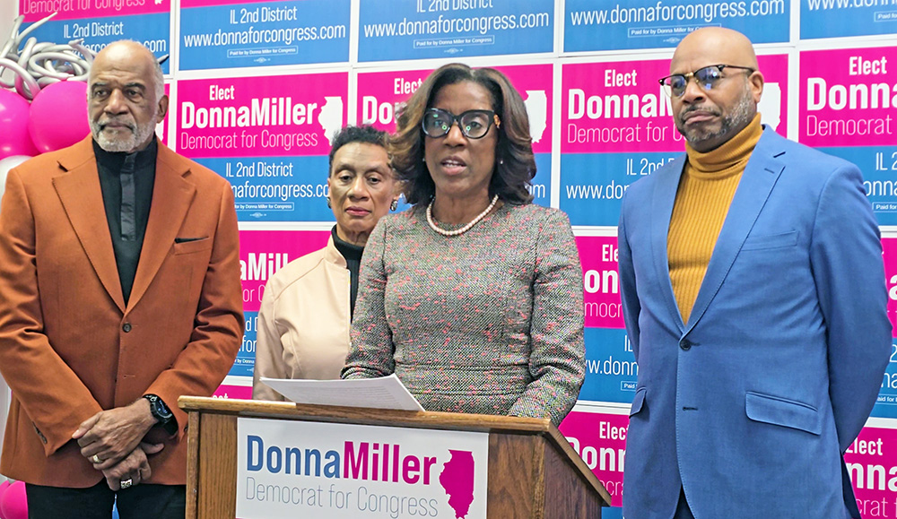 Donna Miller urges state and local elected officials to speed up development of the proposed South Suburban Airport after news reports that the FAA is proposing a cap on flights in and out of O'Hare Airport. With her are, from left, Flossmoor Trustee George Lofton, Glenwood Trustee Linnetta E. Taylor and Pastor Lawrence Blackful of Chicago Heights. (Eric Crump/H-F Chronicle)