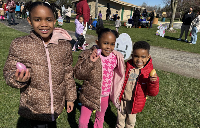 Posley siblings, from left, Dakota, Dana and David, show off a few eggs from their collection at the park district's egg hunt event. (Marilyn Thomas/H-F Chronicle)