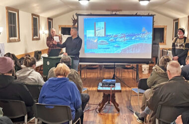 Izaak Walton Preserve President John Brinkman, center, welcomes preserve members before turning over the meeting to Tristan Shaw, right, who talked about native plants. (Jon Bannister/H-F Chronicle)