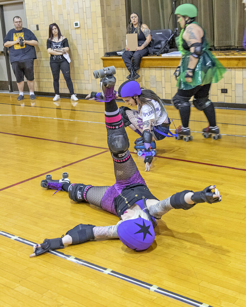 The skater Eurothrash recovers from a spill taken during a Chicago Knockouts Roller Derby bout at H-F Auditorium. (Colin Thomas/Thomas Photographic Services)