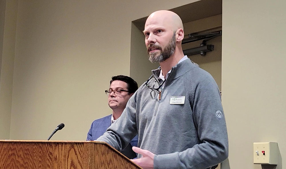 Holladay Properties CEO Drew Mitchell describes the company's experience and plans for developing two sites in downtown Homewood at the March 10 board meeting. (Eric Crump/H-F Chronicle)