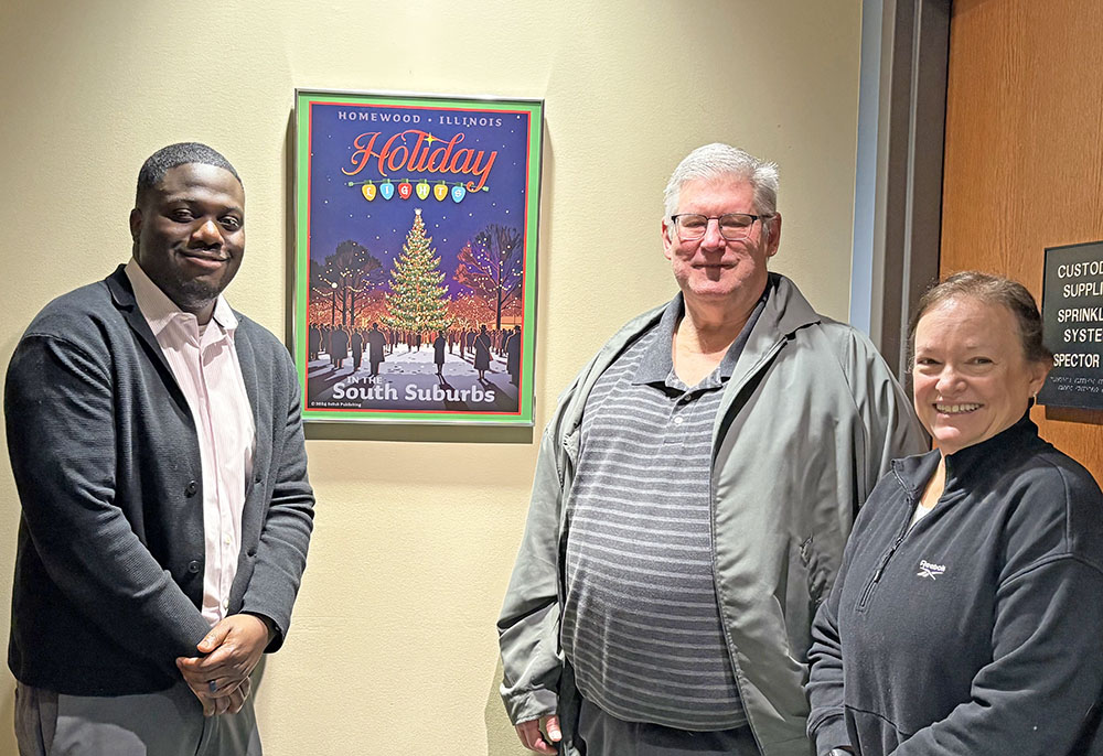 Homewood Assistant Village Manager Terence Acquah, left, with the artist of the Homewood Holiday Lights poster, Terrence Meehan, and Meehan's wife at village hall. (Summer Kiswani/H-F Chronicle)
