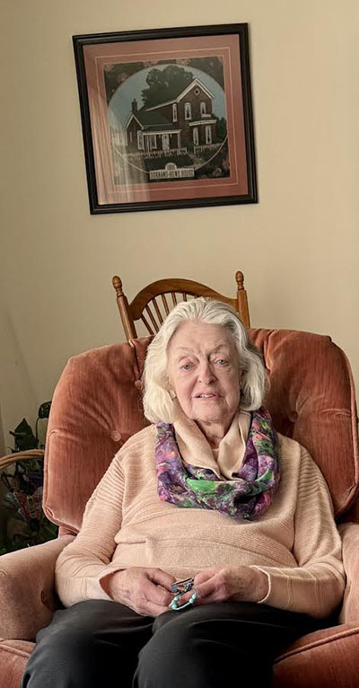 Elaine Egdorf in her living room, which is adorned with images of Homewood she created. (Karen Torme Olson)