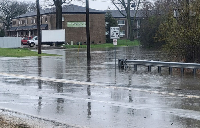 Governors Highway is still closed and mostly covered by water about 11:30 a.m. Saturday. (Eric Crump/H-F Chronicle)
