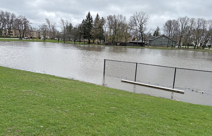 The Leavitt Park detention basin is filled nearly to the brim at about 12:45 p.m. Saturday. (Marilyn Thomas/H-F Chronicle)