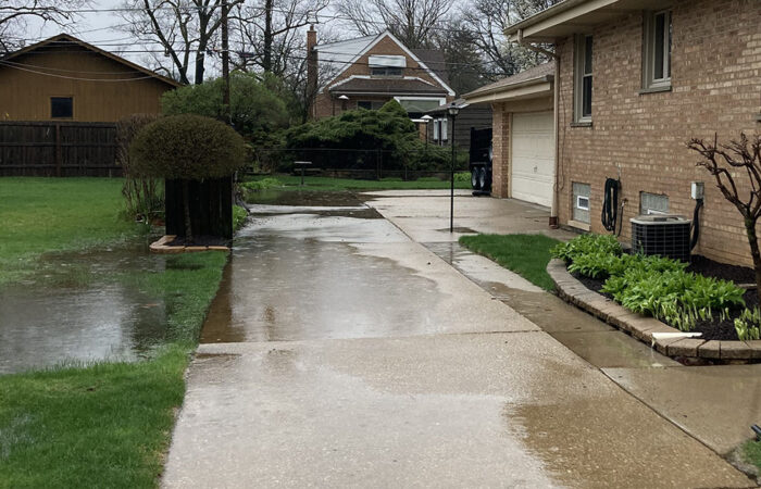 This photo of a soggy yard and driveway was taken about 10:30 a.m. Saturday. (Missy Mason/provided)