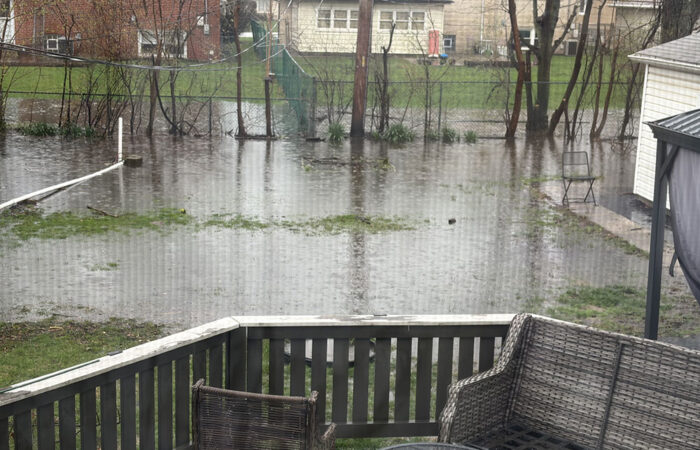 A back yard on Birch Road is covered in water after storms late Friday and early Saturday. This photo was taken about 7:30 a.m. Saturday. (Heather Bush/provided)