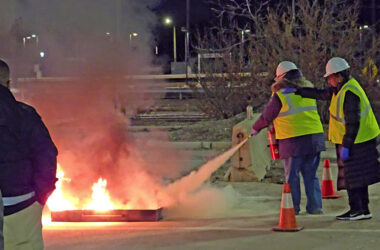 Homewood CERT volunteers practice using a fire extinguisher in the parking lot behind the Homewood Fire Department. (Eric Crump/H-F Chronicle)