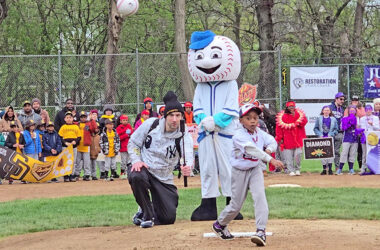 Myles Toney throws the ceremonial first pitch to open the Flossmoor Baseball and Softball season on Saturday, April 18. (Eric Crump/H-F Chronicle)