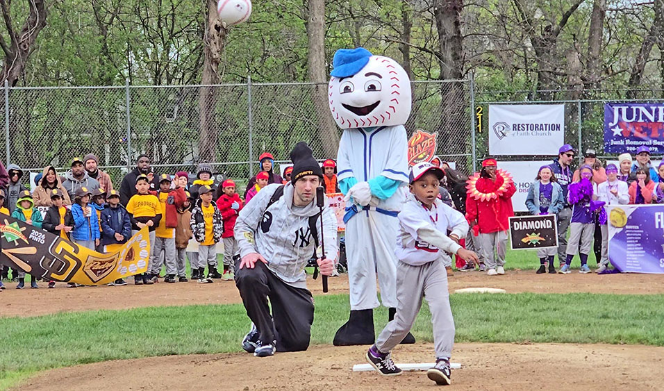 Myles Toney throws the ceremonial first pitch to open the Flossmoor Baseball and Softball season on Saturday, April 18. (Eric Crump/H-F Chronicle)