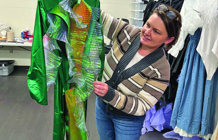 H-F 2_CMYK Candi Helsel-Wilk with one of the 84 costumes she designed and created for the musical. (Marilyn Thomas/H-F Chronicle)