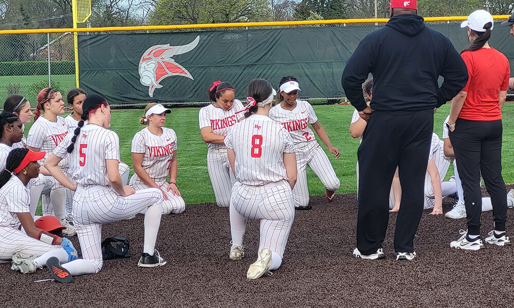 Homewood-Flossmoor softball coaches speak to the team after an 8-0 loss to Bradley-Bourbonnais April 15. (David P. Funk/H-F Chronicle)