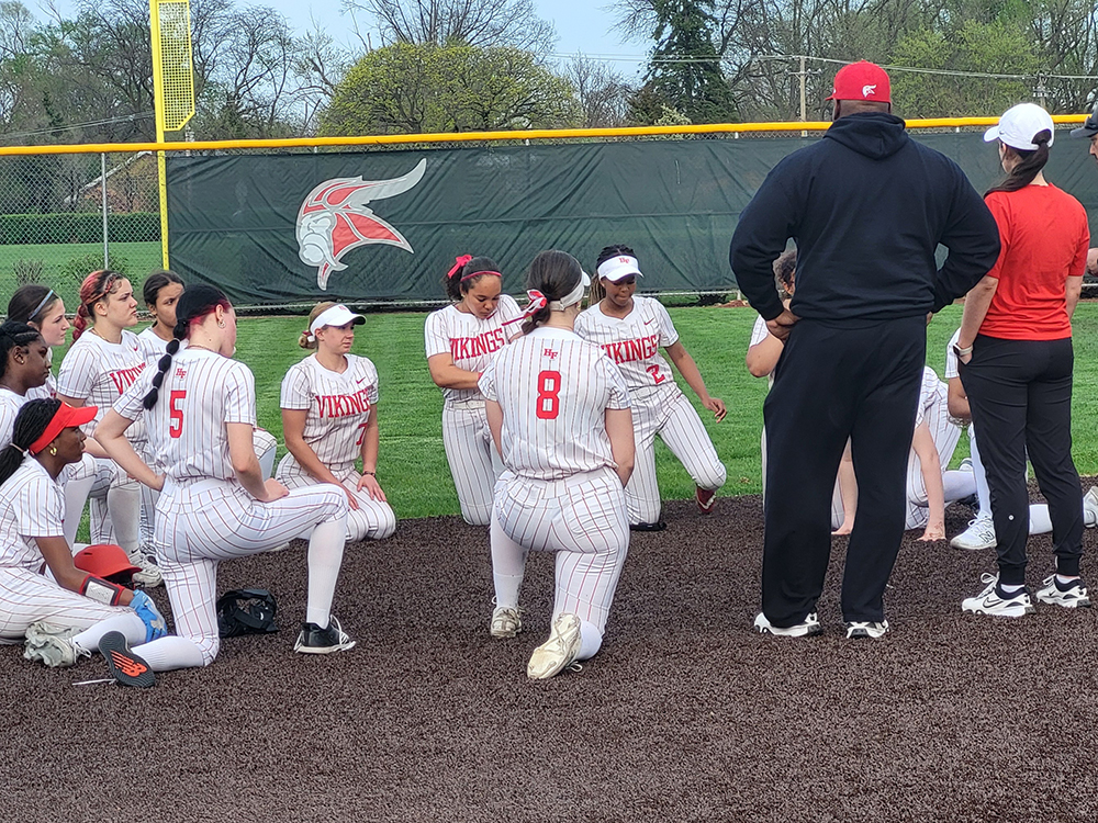 Homewood-Flossmoor softball coaches speak to the team after an 8-0 loss to Bradley-Bourbonnais April 15. (David P. Funk/H-F Chronicle)