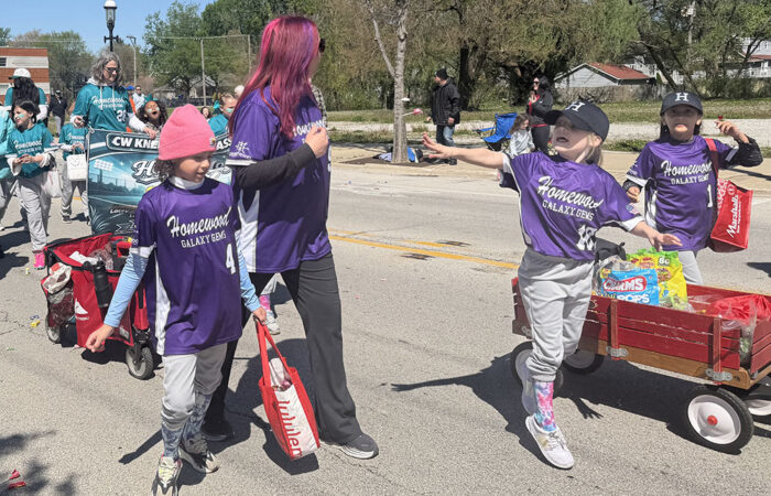 The Galaxy Gems march in the Homewood youth baseball and softball opening day parade. (Nick Ulanowski/H-F Chronicle)