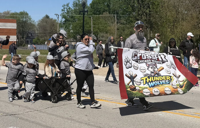 The Thunderwolves march in the Homewood youth baseball and softball opening day parade. (Nick Ulanowski/H-F Chronicle)