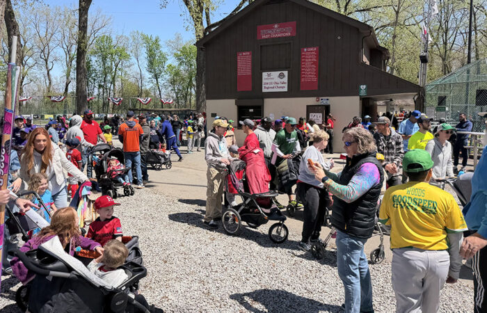 The families of Homewood youth baseball and softball players gather at the opening day ceremony on April 25. (Nick Ulanowski / H-F Chronicle)