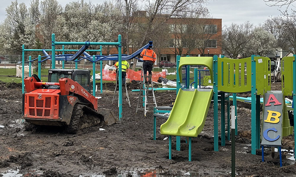 Crews are busy building the new play equipment at Irwin Park in Homewood, replacing equipment that dated to 1986. (Marilyn Thomas/H-F Chronicle)