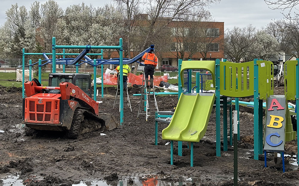 Crews are busy building the new play equipment at Irwin Park in Homewood, replacing equipment that dated to 1986. (Marilyn Thomas/H-F Chronicle)