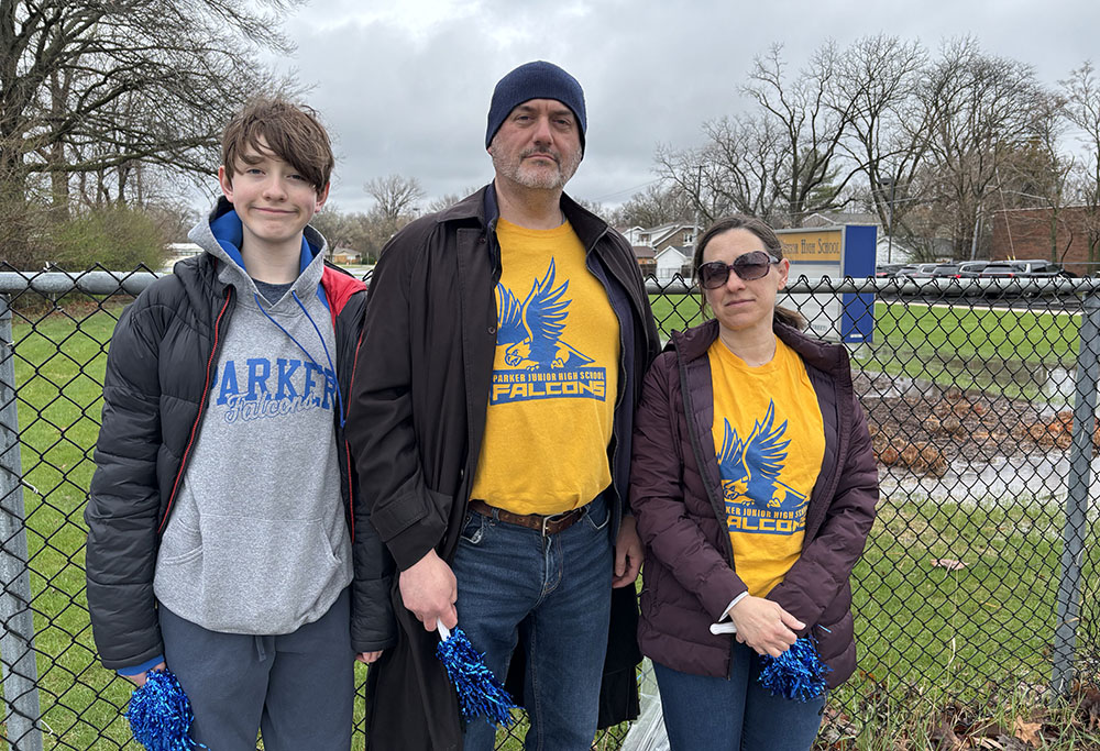 The O'Shea family, from left, Sam, an eighth grader at Parker Junior High, and his parents, James and Elisha, wear their Parker pride as they prepare to honor Kyran Smith. (Marilyn Thomas/H-F Chronicle)