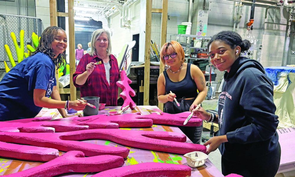 One of several painting crews, from left, senior Madison Jean, painting advisor Jane Nix, freshman Rayson Juan and senior DeAnna Williams prepare the underwater scenery for "The Little Mermaid" at Homewood-Flossmoor High School. Their work, and that of dozens of others, helps put the show together. (Marilyn Thomas/H-F Chronicle)