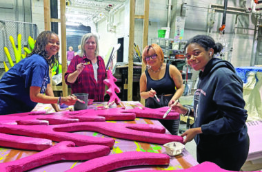 One of several painting crews, from left, senior Madison Jean, painting advisor Jane Nix, freshman Rayson Juan and senior DeAnna Williams prepare the underwater scenery for "The Little Mermaid" at Homewood-Flossmoor High School. Their work, and that of dozens of others, helps put the show together. (Marilyn Thomas/H-F Chronicle)