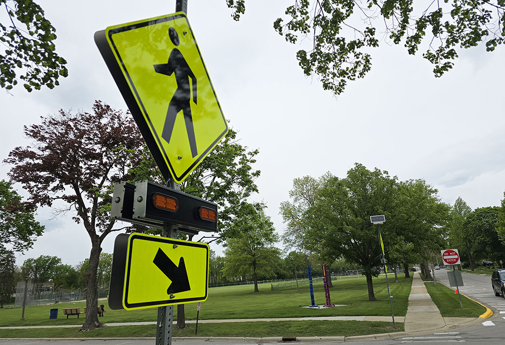 Flossmoor recently installed a new flashing crosswalk sign at Flossmoor Road and Brassie Avenue to help improve pedestrian safety near Flossmoor Park and Western Avenue School. (Eric Crump/H-F Chronicle)