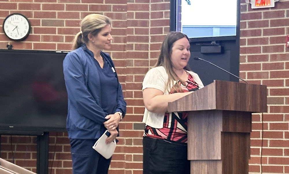 From left, Flossmoor Public Library Board President Natasha Bergeron and Executive Director Jamie Paicely address the village board on the issue of which organization should be responsible for repairing a problem under the library's foundation. (Jon Bannister/H-F Chronicle)