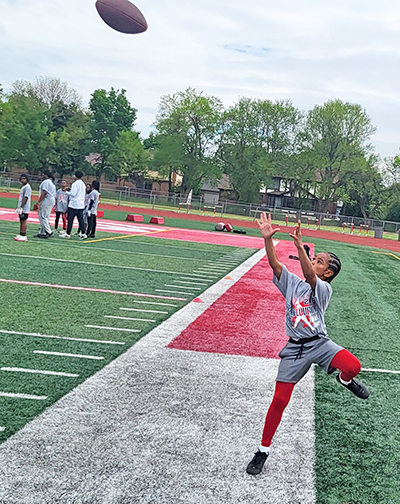 Camper Eriyonn Smith, who plays for H-F United, catches a touchdown during scrimmages. (David P. Funk/H-F Chronicle)