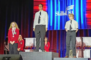 Charley Dieringer, a senior at Homewood-Flossmoor High School, stands on the top podium after winning first place in two competitions at SkillsUSA Illinois. (Provided photo)
