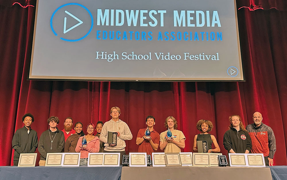Homewood-Flossmoor High School teachers join their students who proudly show off their trophies at the Midwest Media Educators Association video festival. The students won 17 awards. (Provided photo)