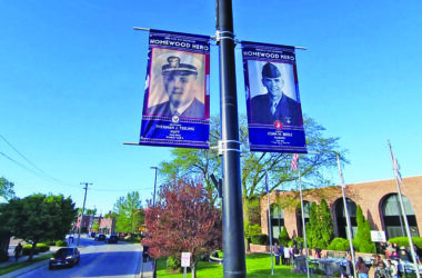 Banners honoring Sherman J. Teeling, who served in the Navy, and John M. Beele, who served in the Marines and currently serves as commander of the Wally Burns VFW Post, are located at the northeast corner of Harwood Avenue and Olive Road. (Eric Crump/H-F Chronicle)