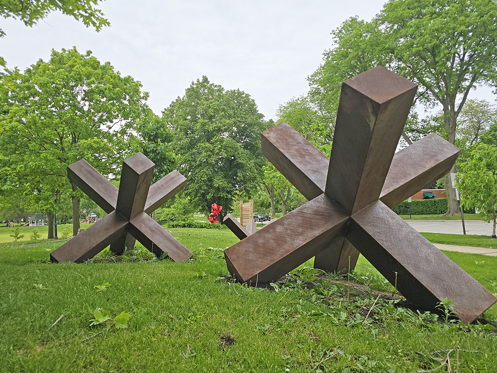 Flossmoor trustees approved the donation of "Land Jacks," a sculpture by Jason Verbeek, to the village's permanent collection. The sculpture has been on loan since 2022 and is on display in Leavitt Park. (Eric Crump/H-F Chronicle)