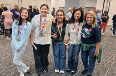 The Illinois History Day first place team from Parker Junior High show off their medals, from left, Avery Cheung, Emma Santiago, Dahlia Thomas and Sophie Folaju with their teacher Linda O’Dwyer. the team will next compete for a national title. (Provided photo)