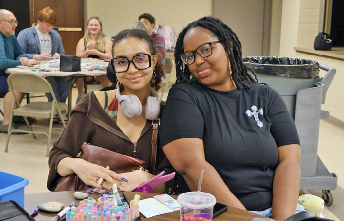 Pebbles and Pins#4_web Leann Swideruk, left, and Nina Anderson, pose during the community rock-painting event on May 8 at Flossmoor Community Church. (Nuha Abdessalam/H-F Chronicle)