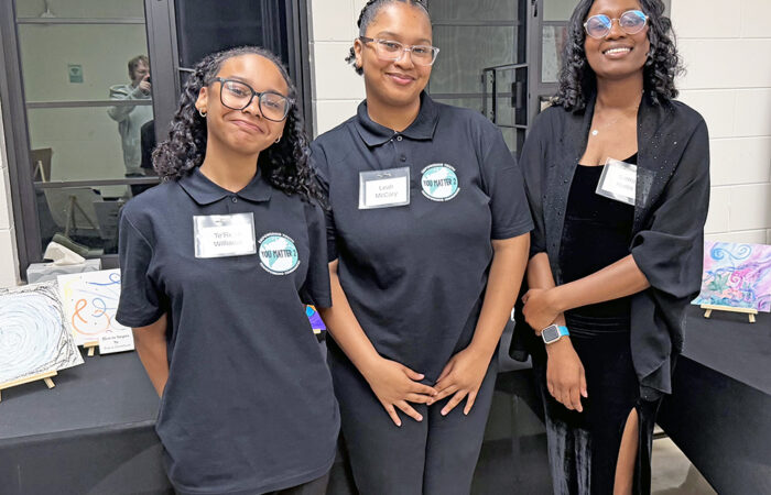 You Matter 2 fundraiser -Ulanowski10_web Students Te’Reya Williams, left, and Leah McCary, center, with art therapist Sierra Harris, right, at the You Matter 2 fundraising event on May 22. (Nick Ulanowski / H-F Chronicle)
