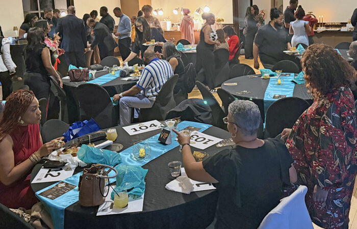 You Matter 2 fundraiser -Ulanowski12_web Community members line up food and dinks and sitting with their auction paddles at the fundraising part of the May 22 event. (Nick Ulanowski / H-F Chronicle)