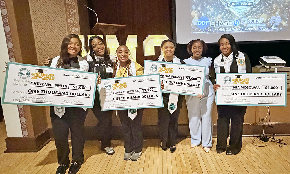 High school programmer Brandy Marshall, second from left, with You Matter 2 graduates Cheyenne Smith, Deenah Fitzpatrick, Zannia Prince and Nia McGowan hold up $1,000 scholarship checks. You Matter 2 founder and CEO Destiny Watson is second from right. (Nick Ulanowski / H-F Chronicle)