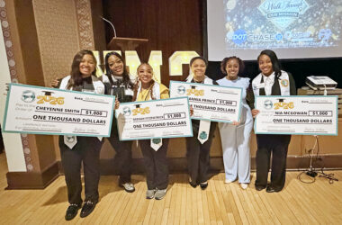 High school programmer Brandy Marshall, second from left, with You Matter 2 graduates Cheyenne Smith, Deenah Fitzpatrick, Zannia Prince and Nia McGowan hold up $1,000 scholarship checks. You Matter 2 founder and CEO Destiny Watson is second from right. (Nick Ulanowski / H-F Chronicle)