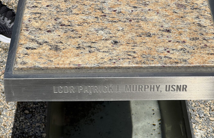 fvm-photo-9-murphy-bench_web In April, IJP’s 8th graders visited the Pentagon memorial in Washington D.C. dedicated to those who died there on 9/11. It consists of 184 cantilevered benches, including this one, which is dedicated to Lt. Cmdr. Patrick J. Murphy of Flossmoor. (Provided photo/Trish Ladner)