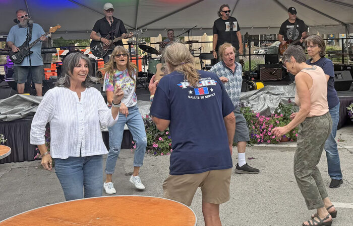 Art & Garden -Ulanowski5_web Community members dancie at the Art & Garden Fair to Big Weekend’s rendition of "I Saw Her Standing There" by The Beatles. (Nick Ulanowski / H-F Chronicle)